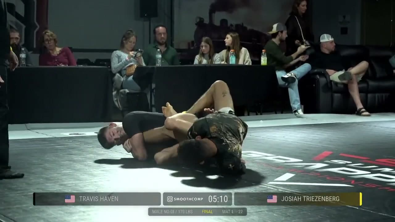 Travis Haven attacks Josiah Triezenberg’s leg during the 170-pound St. Louis qualifier final.